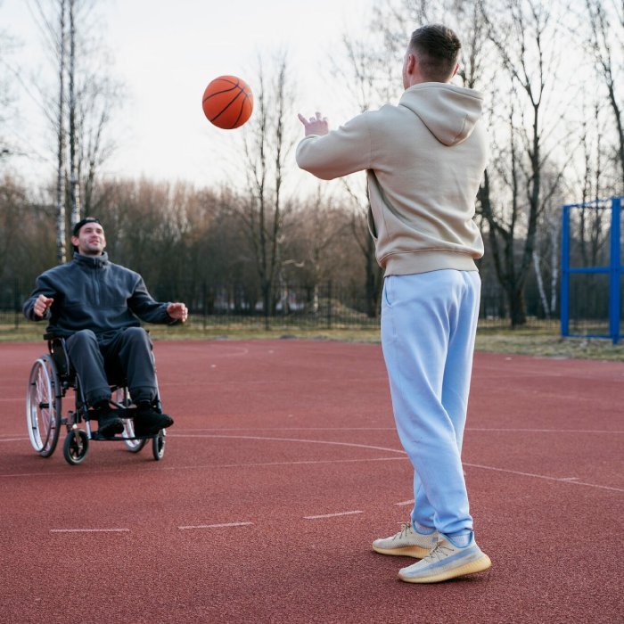 Disabled person in wheelchair playing basketball