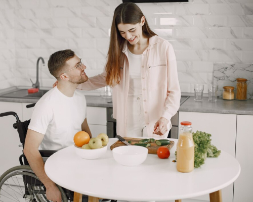 Friendly support worker providing household tasks assistance,